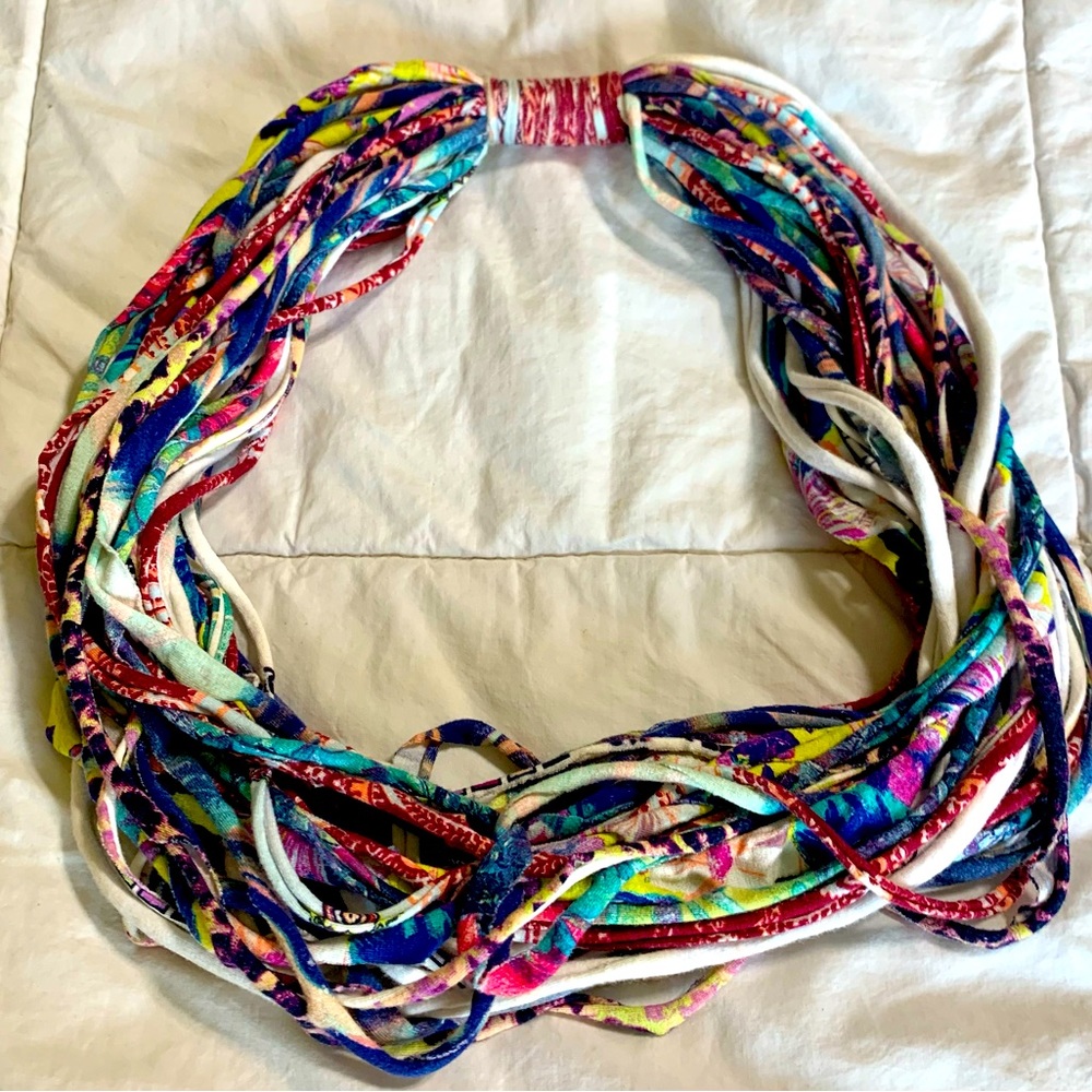 This scarf is made with recycled “t”-shirts!